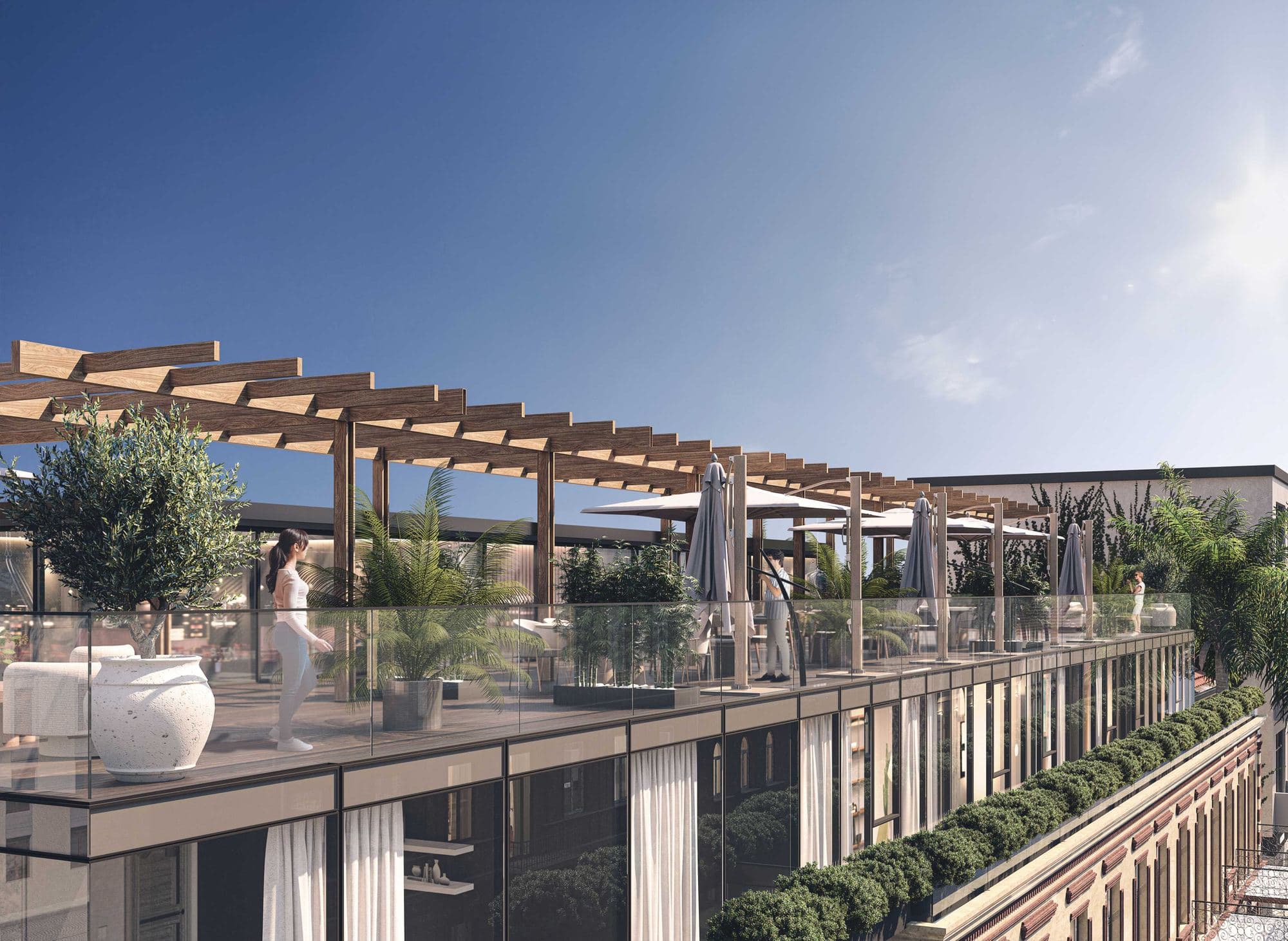 La terrasse partagée en toiture, pergola et plantations face au ciel de Batumi